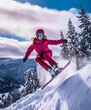 Woman in professional alpine ski gear. Hanging down from snowiest mountain