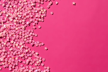 pink shining stars scattered on a pink background with free space for your text or design. a wonderf