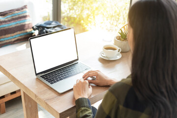 computer screen blank mockup.hand woman work using laptop with white background for advertising,contact business search information on desk at coffee shop.marketing and creative design