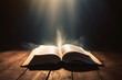 © Creative Clicks - Open Bible with a light coming from above on a wooden desk Image ai generate