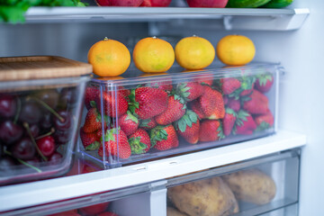 Open fridge full of fresh fruits and vegetables, vegetarian food healthy food background, greenery, organic nutrition, health care, dieting concept.