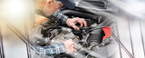Fototapeta  - Car mechanic working on car engine; multiple exposure