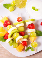 Wall Mural - delicious mixed fruit skewer and dipping sauce- healthy eating