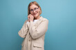 © Ivan Traimak - joyful smiling 50s mature woman smiling on plain background with copy space