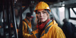 © Lubo Ivanko - Woman working in a factory or plant, young female with protective hard hat helmet, blurred heavy machinery around. Gender equality at workplace concept. Generative AI