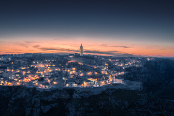 Wall Mural - Matera city skyline, the ancient town of Matera at sunrise or sunset, Matera, Italy