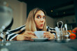 © nicoletaionescu - Funny Woman Having a Cup of Coffee in a Restaurant. Curious friend reacting to shocking news having tea