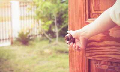 Wall Mural - Grand opening women hand open door knob or opening the door, grand opening, Close up hand open door.