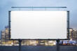 Blank white horizontal billboard on skyline background at evening, front view. Mock up, advertising concept