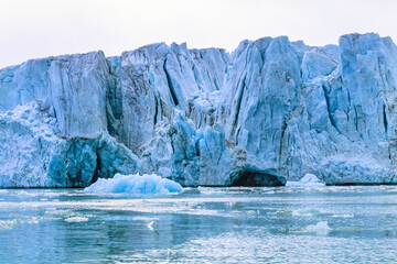 Wall Mural - Glacier with big seracs by the sea in arctic