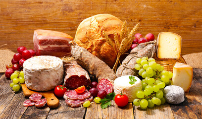 Sticker - composition of cheese, salami,bread and grapes