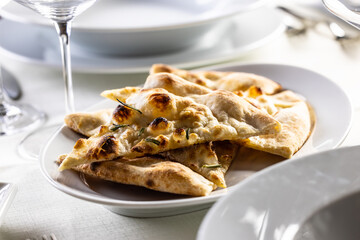 Wall Mural - Italian dry pizza dough baked and sliced as a crunchy side dish in a restaurant