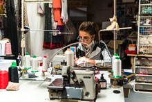Seamstress Sewing A Dress On The Riveting Machine