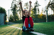 © Cavan Images - girl cheering for her team mates whilst playing football