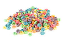 Pile Of Delicious And Nutritious Fruit Cereal Rings Isolated On A White Background. Colored Sweetened Corn Cereals.