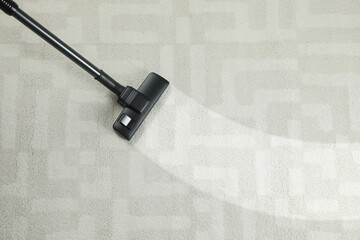 Wall Mural - Hoovering carpet with vacuum cleaner, top view and space for text. Clean trace on dirty surface