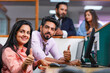© Niks Ads - Indian corporate people working on computer and showing thumps up at office.