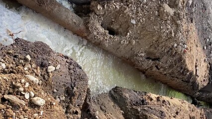 Wall Mural - Trench filled with water, replacement of pipes and communications.