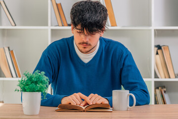 Canvas Print - young male student studying at desk