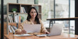 © itchaznong - Accountant woman working on laptop and do document, tax, exchange, research, accounting and Financial advisor concept