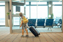 Cute Blond Child, Kid With Backpack, Boarding Airplane At The Airport On Sunset, Enjoying The View