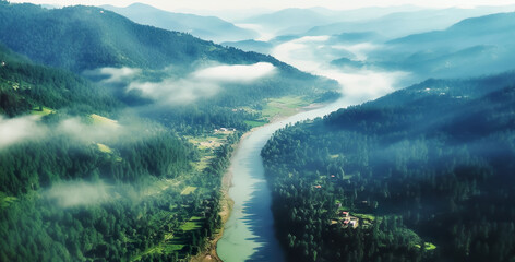 drone view.abstract rain forest or evergreen forest with river stream and landscape mountain in mist