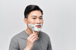 © makistock - Handsome man enjoying morning bath routine, caring for appearance, healthy facial skin