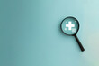 Magnifying glass focus on healtcare and medical insurance icon with copyspace over blue background idea for Healthcare and Insurance,medical.