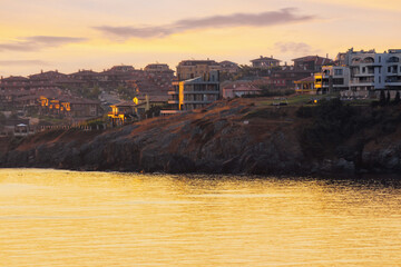 Wall Mural - coastline with resort town of sozopol. beautiful seascape scenery in morning light. bulgarian vacation at the sea