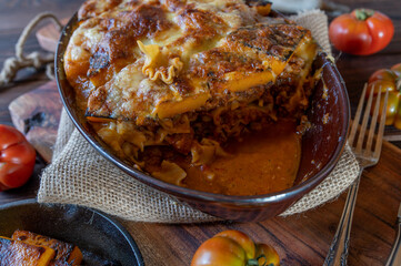 Sticker - Noodle casserole with meat sauce and roasted pumpkin cheese topping.