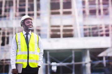 Wall Mural - African architects engineer man with tablet work together in the inside the construction building site.Engineering concepts and technological applications.