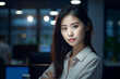 Asian woman working late at night in the office, asian woman working, close up depiction, digital photo, portrait, looking at camera, natural light, affinity, bright background Generative AI