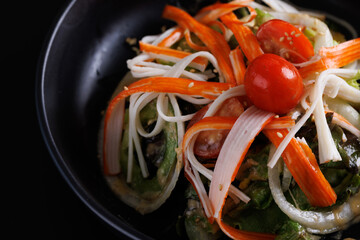 Wall Mural - Japanese salad isolated in black background