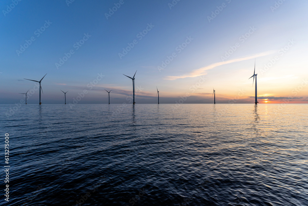 offshore wind farm at sunset Stock Photo | Adobe Stock