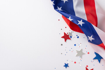 Wall Mural - Labor Day in USA concept. Above view photo of empty space with white, blue and red star-shaped sparkles and american flag on the right on white isolated background with copy-space