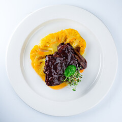 Sticker - Lunch beef fillet steak in sauce with cauliflower and microgreens.