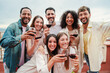 © Jose Calsina - Group of cheerful best friends on a rooftop wine party. Crowd of young people drinking, toasting glasses, laughing and having fun on a friendly meeting, enjoying happy hour at winery bar restaurant