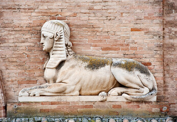 Wall Mural - Urbino, Italy - 2023, May 5: Stone sphinx (detail) on the facade of the Teatro Sanzio..