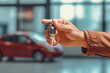© VisualProduction - Close up of male hand giving a car key for vehicle, buying new car, renting car. Generative AI