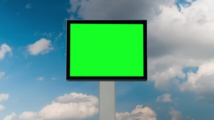 Wall Mural - timelapse - blank square green billboard or large advertising display and moving white clouds agains