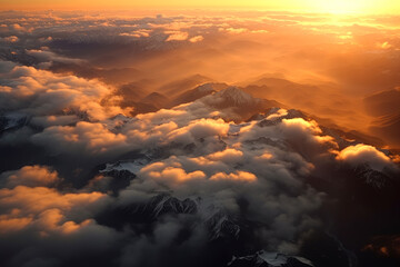 Wall Mural - Sunset over mountain ranges with mountains covered by clouds