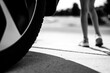 © Lost_in_the_Midwest - Selective focus on pavement with a vehicle tire in the foreground and a blurred child standing in the path.
