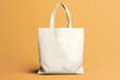 Blank white tote bag mockup isolated on yellow background, eco cotton bag. Generative AI
