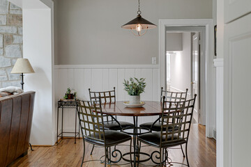 Wall Mural - Calm Luxury Modern Dining Room Interior with Cobblestone Wall and Gothic Modern Pendant Light