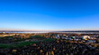 Horizontale Luftaufnahme von Konstanz Sonnenbühl, dem Bodensee und einem Alpenpanorama beim Sonnenuntergang. Bodensee, Konstanz, Baden-Württemberg, Deutschland, Europa.