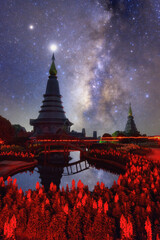 Wall Mural - spectacular milky way over a sacred temple at doi inthanon national park, chiang mai, thailand.