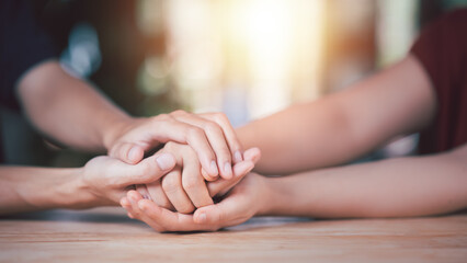 Husband and wife join hands to cheer ,Relationship care concept ,comforting family members ,mutual encouragement ,tenderness ,comfort and sympathy ,helping ,giving hope and believing