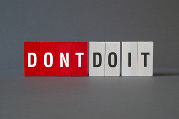 Dont do it - word concept on building blocks, text