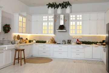 Sticker - Cozy spacious kitchen decorated for Christmas. Interior design