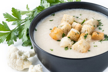 Wall Mural - Cauliflower soup in a bowl isolated on white background.Close up